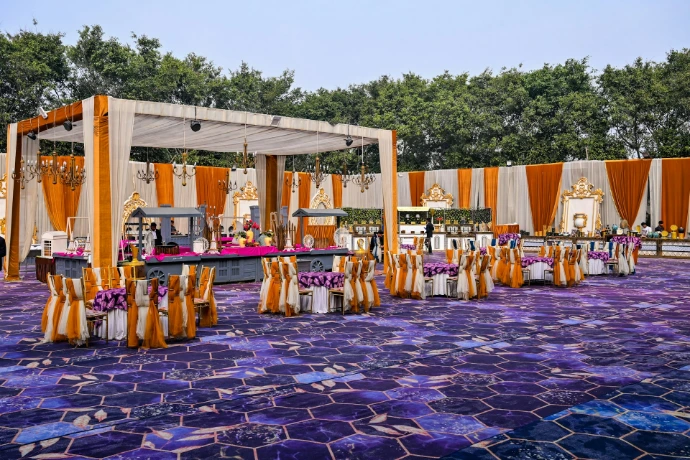 An outdoor event set up with chairs and tables.